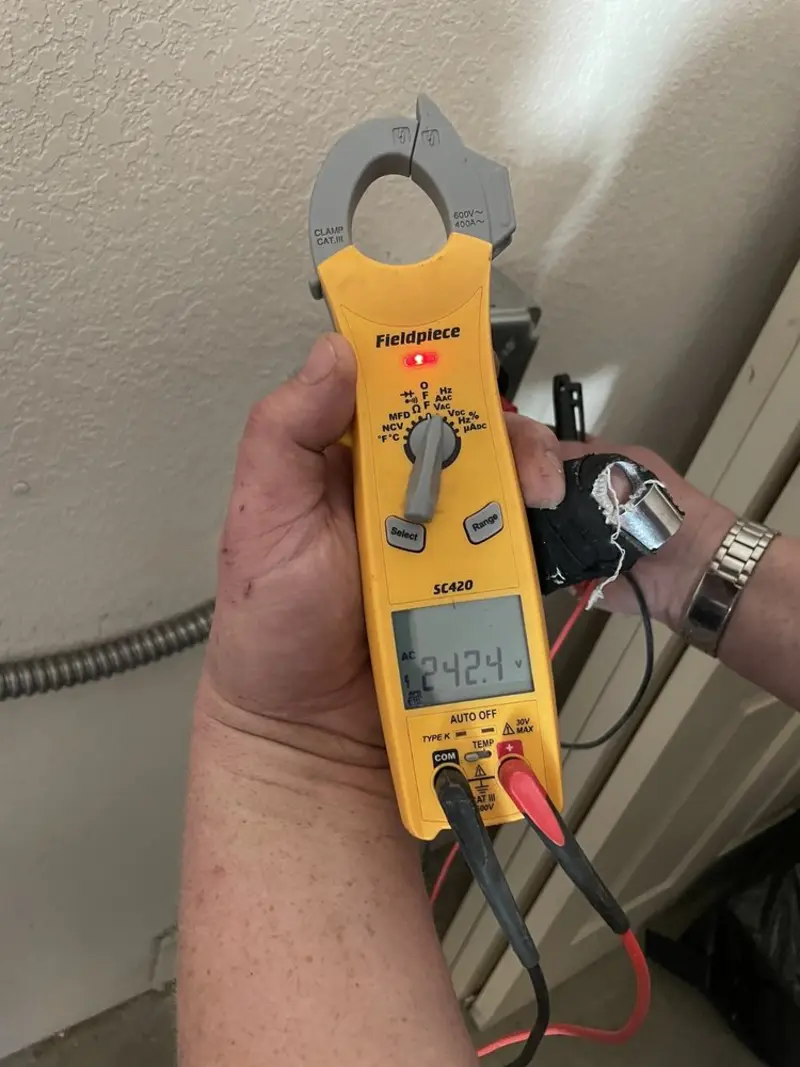 Voltage testing with clamp meter during Generator Installation in Woodfield
